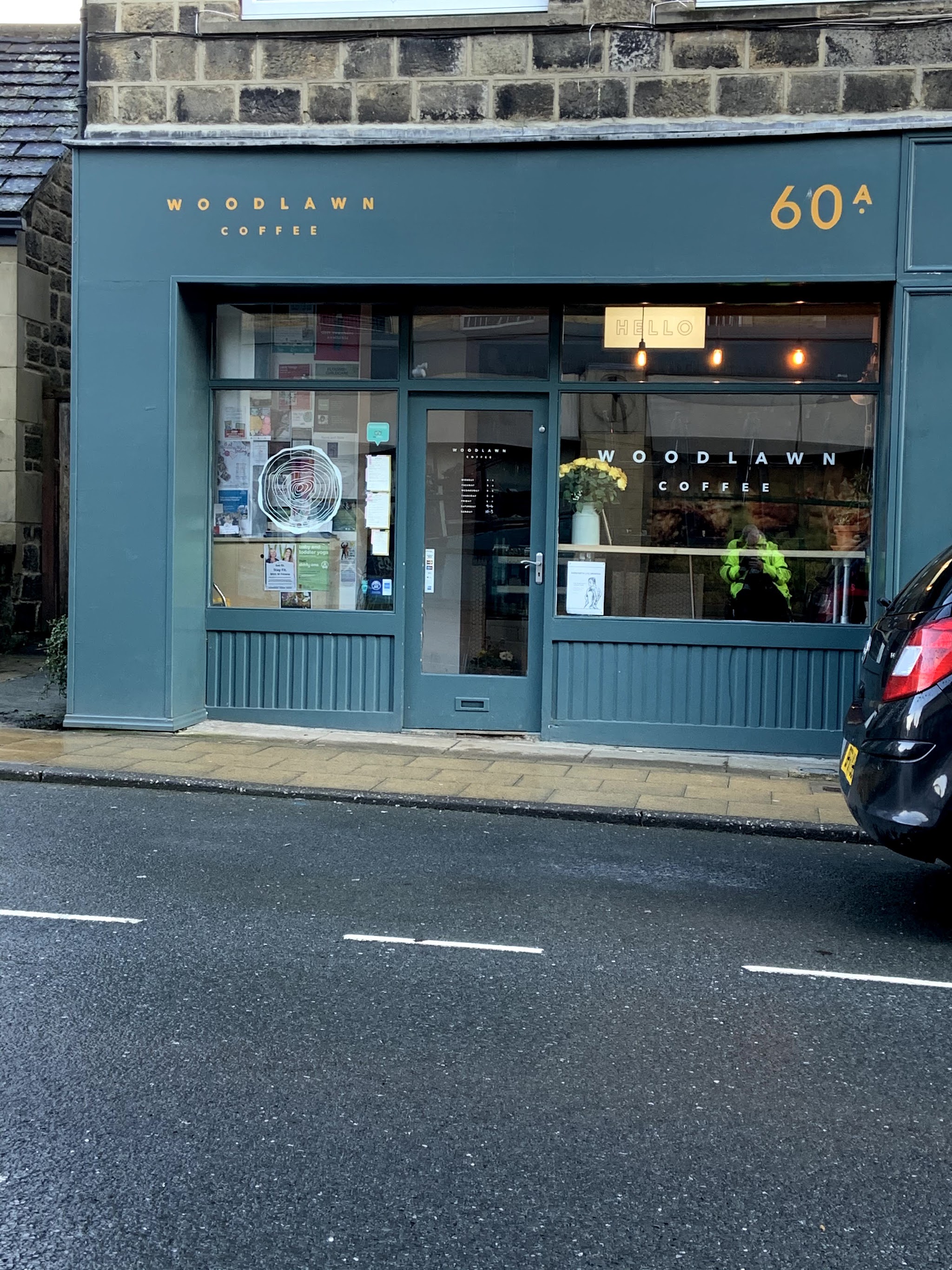 The teal Woodlawn Coffee shopfront at 60A Town Street